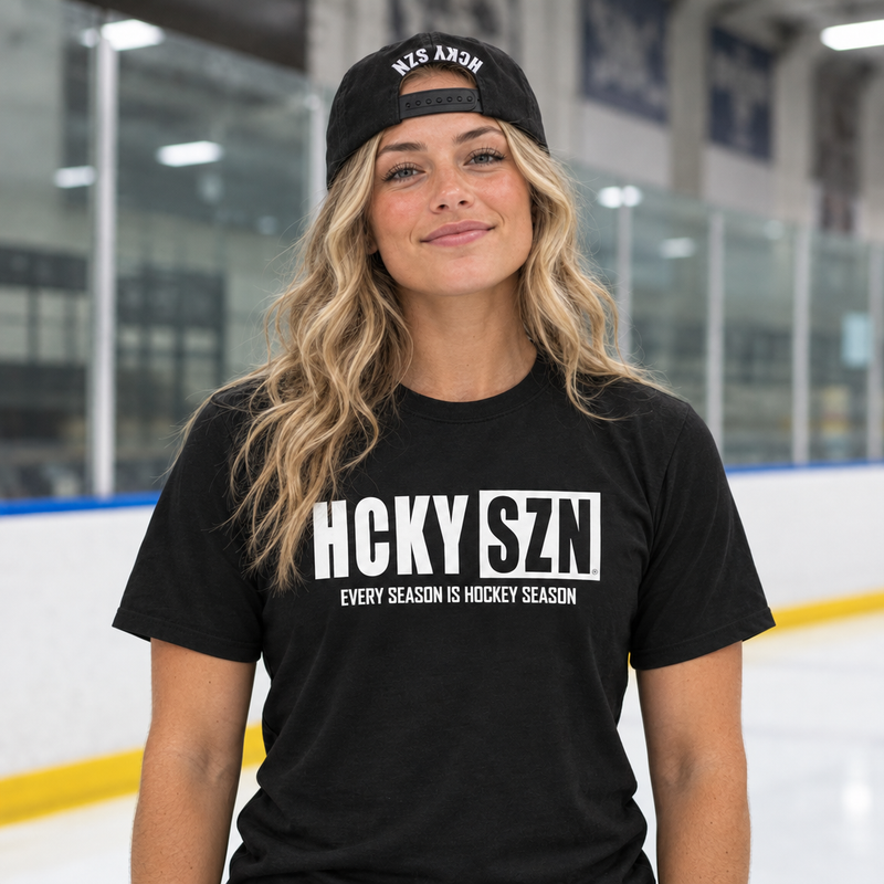 Wavy-haired blonde model wearing the referenced Every Season tee and backwards Black/White HCKY SZN hat