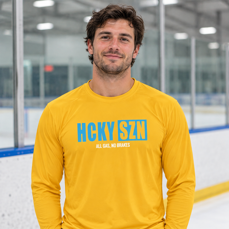 Square hockey lifestyle image featuring the Gold and Sky Blue performance shirt